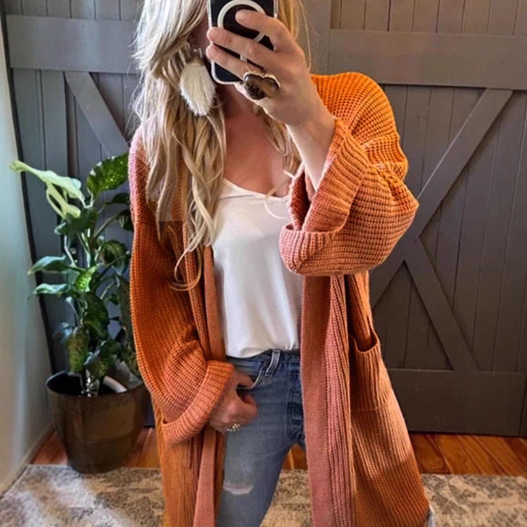 Women's airy cardigan with practical pockets and loose fit