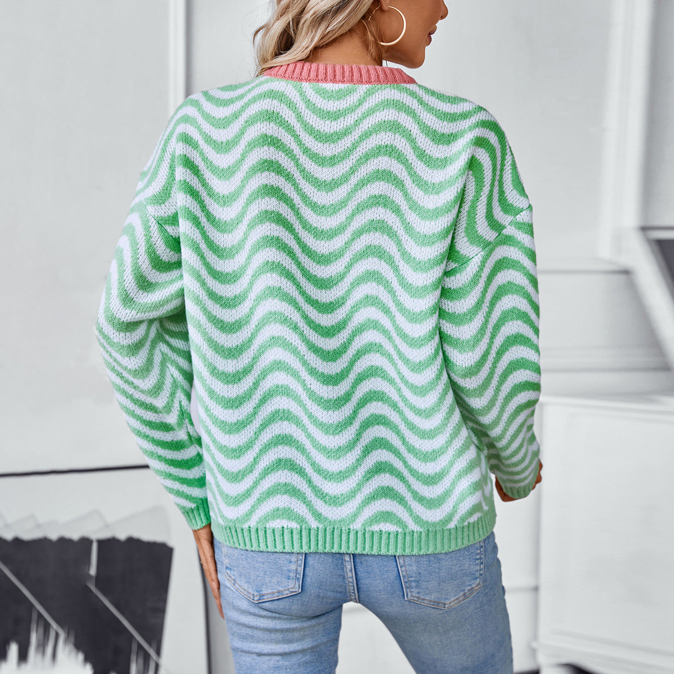 Women's cozy pullover with modern wave patterns and minimalist fit