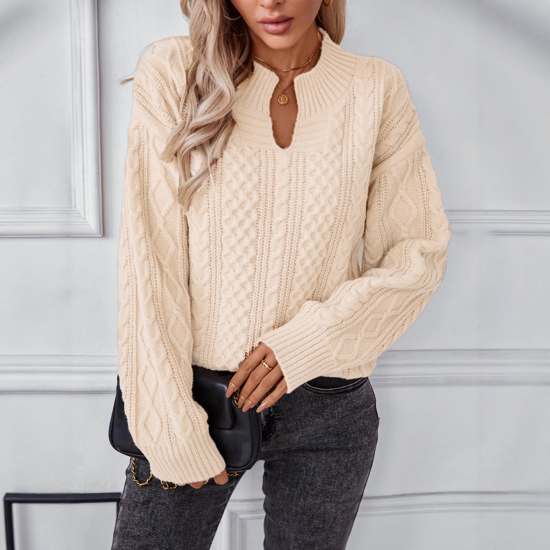 Ladies fashionable knit pullover with unique cable design and round neckline
