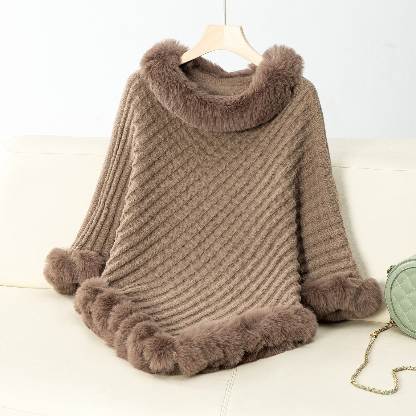 Women's cozy knitted blanket with luxurious faux fur trim