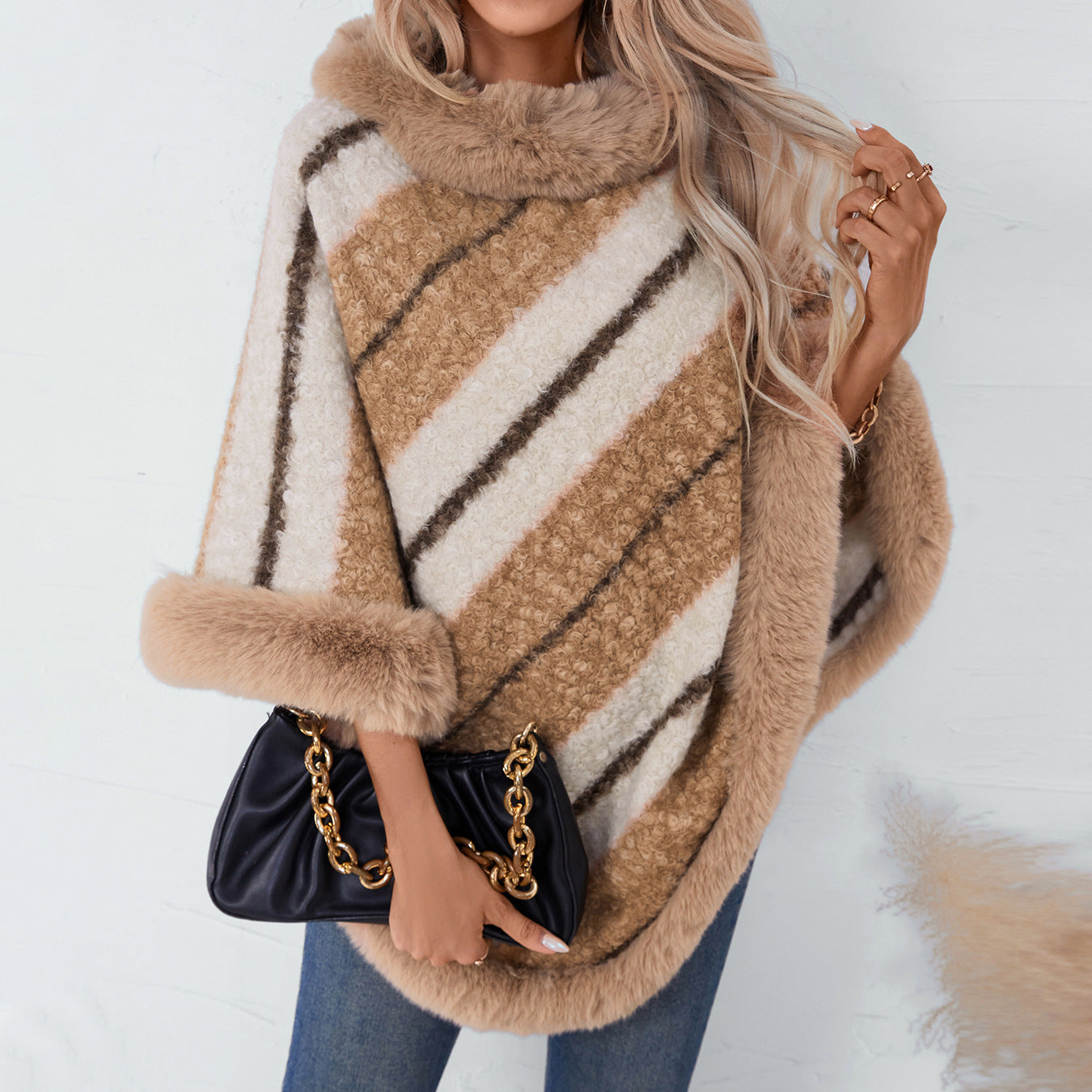 Ladies elegant poncho with luxurious fur trim