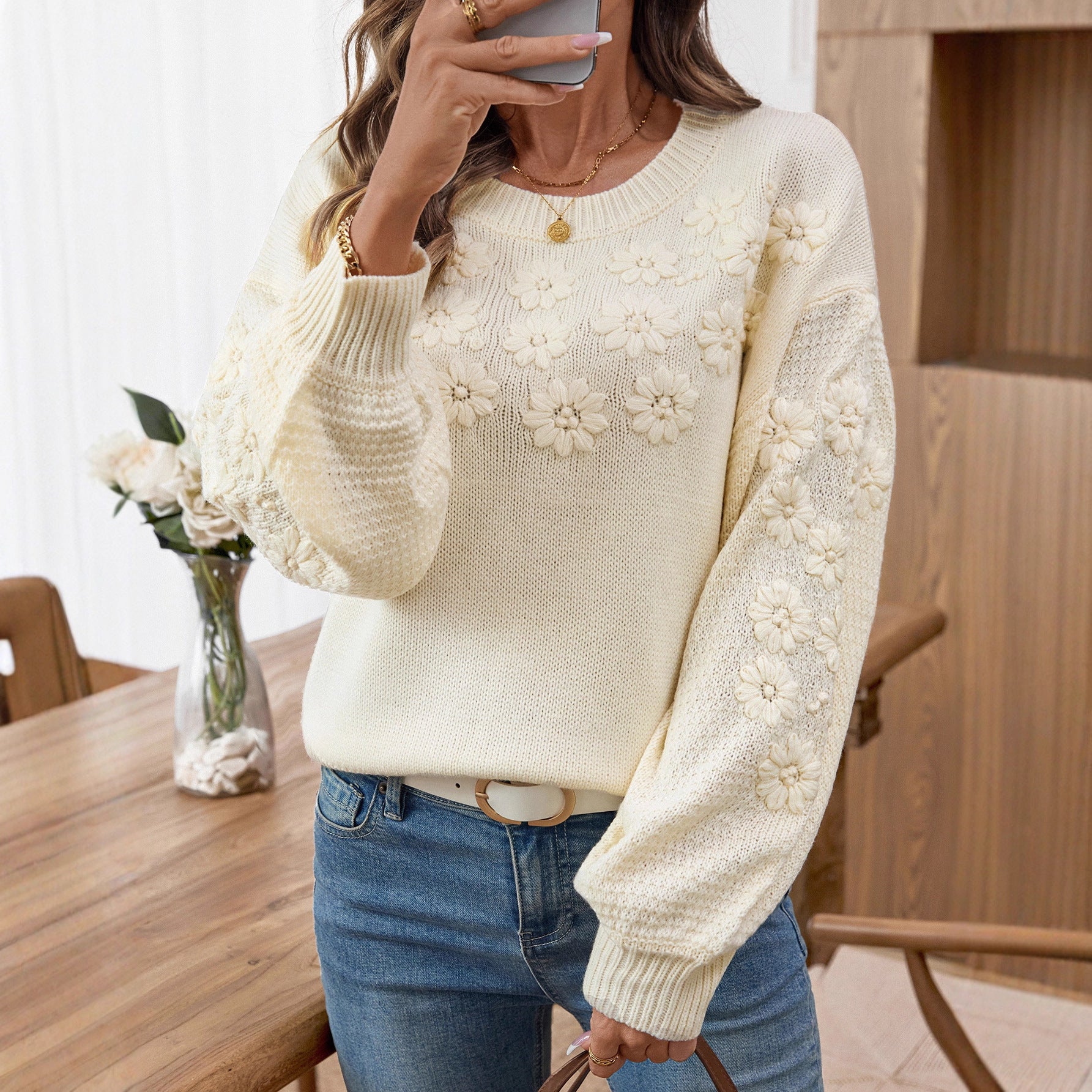Ladies fashionable pullover with floral embroidery and textured sleeve