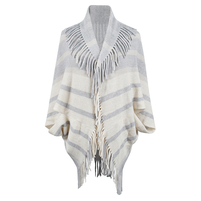 Women’s fashionable knitted poncho with casual fringe design and elegant structure