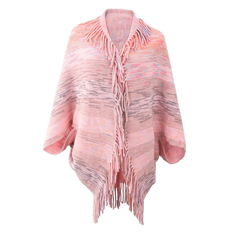 Ladies fashionable poncho with fringed hem and textured design