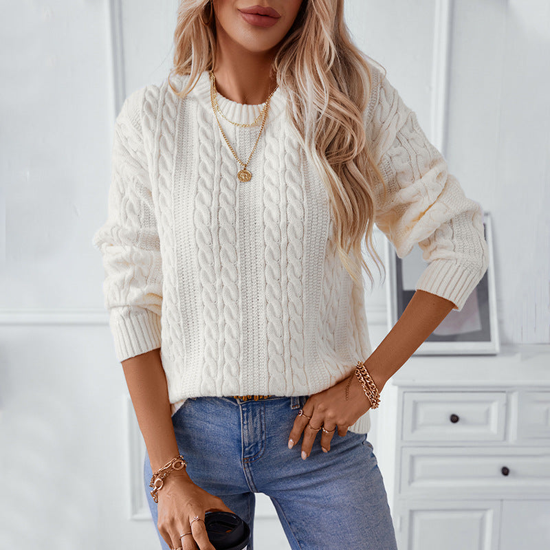 Women's knitted pullover with cable pattern and high cuffs