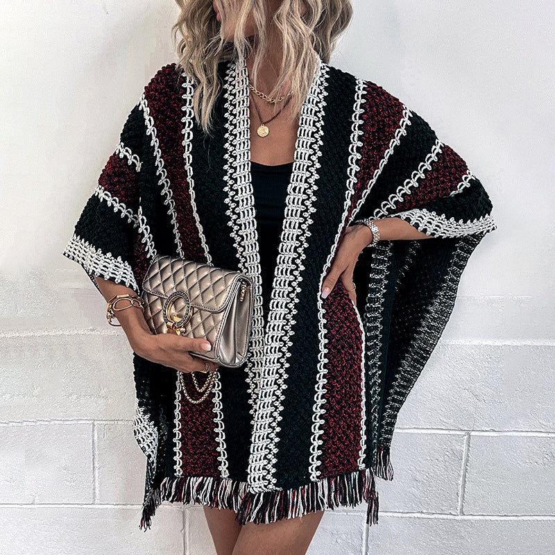 Women's knit poncho with V-neck and fringes