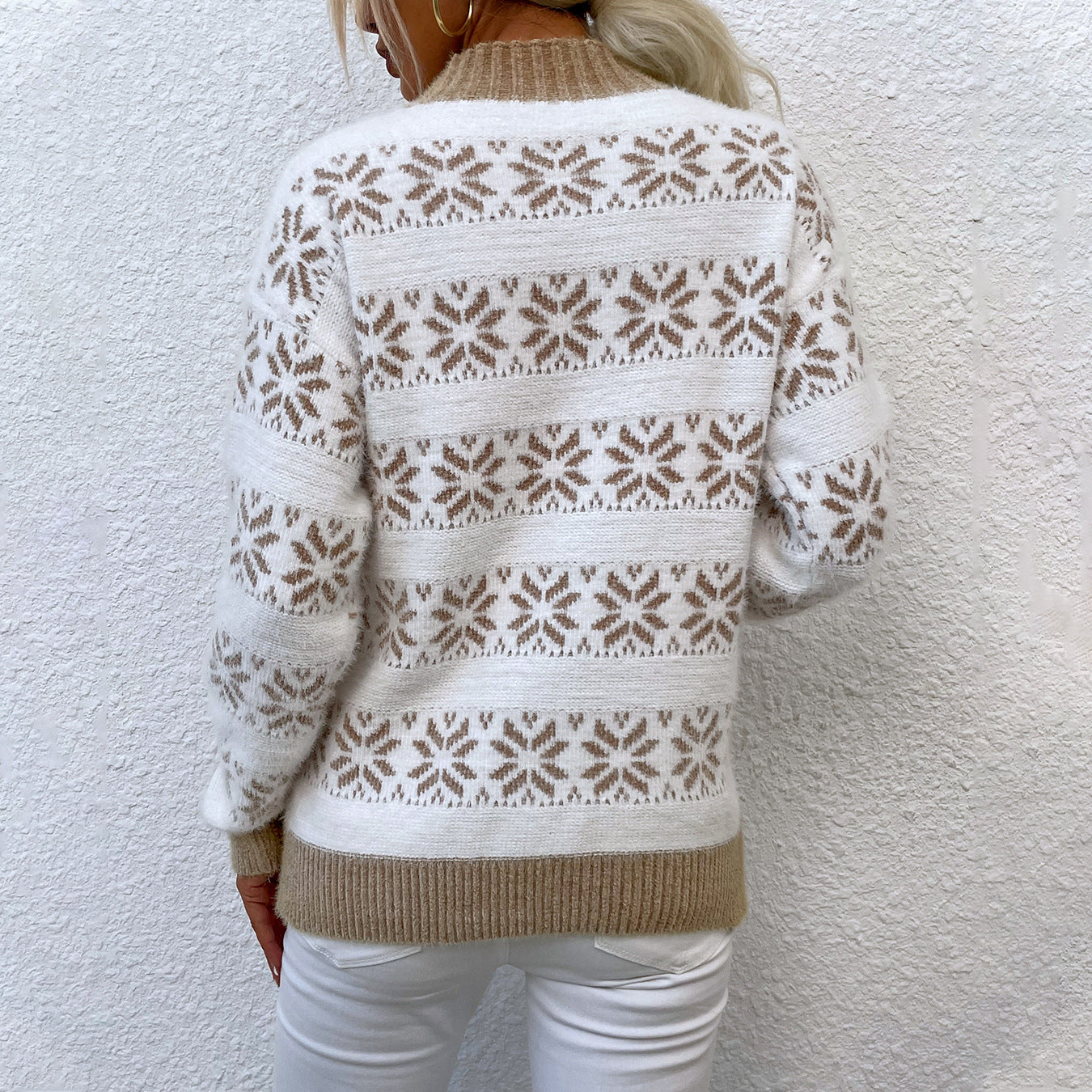 Women's knit pullover with winter motif and high neck collar