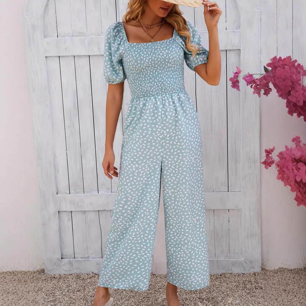 Women's floral patterned jumpsuit with puff sleeves and side pockets