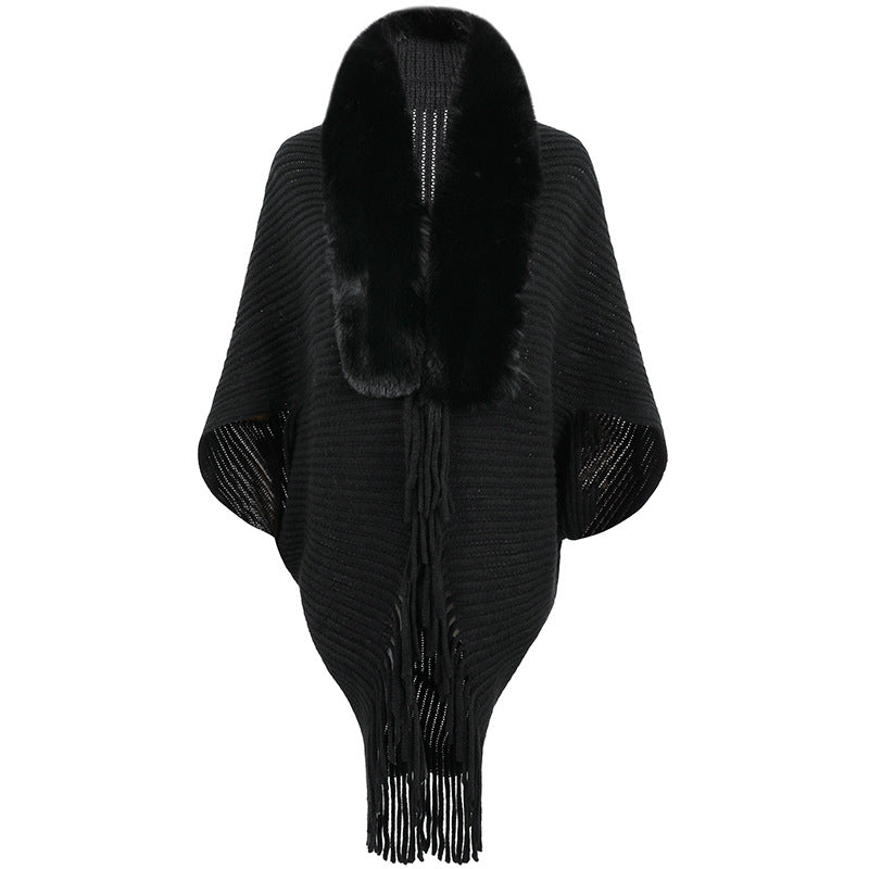 Women's luxurious knit poncho with elegant faux fur collar and fringes