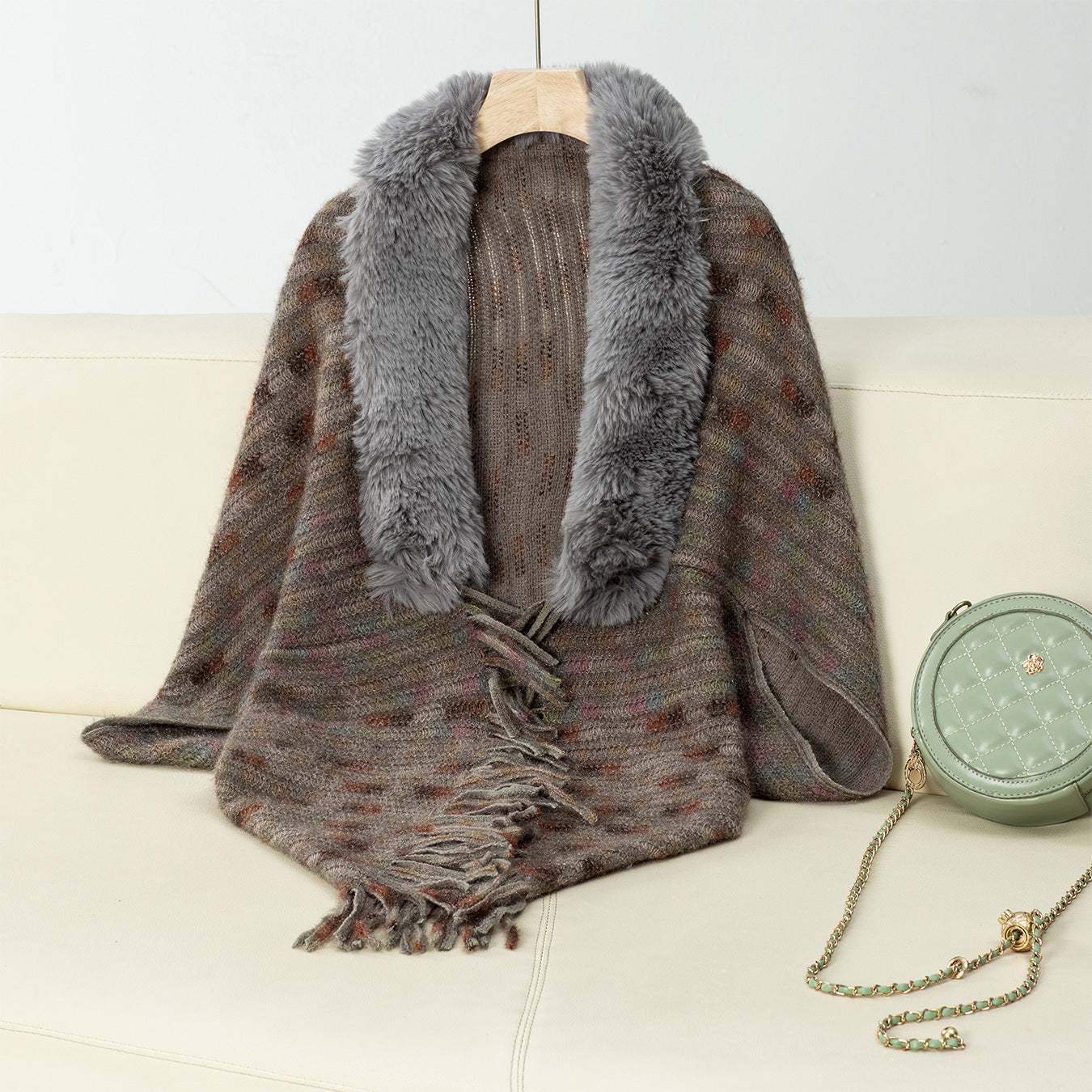 Ladies elegant poncho with luxurious faux fur collar and fringes