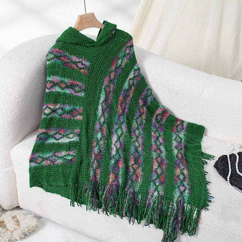 Ladies knit poncho with hood and fringed design