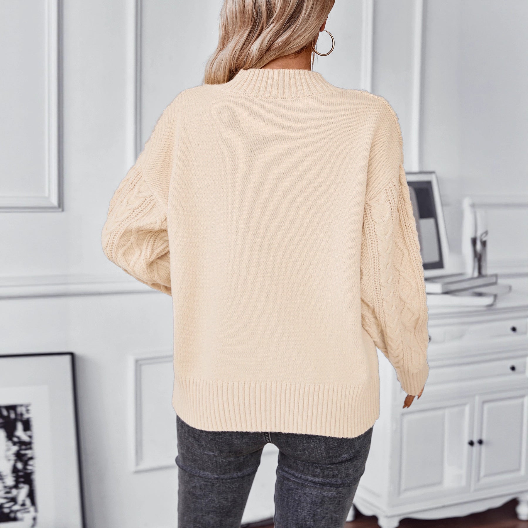 Ladies fashionable knit pullover with unique cable design and round neckline