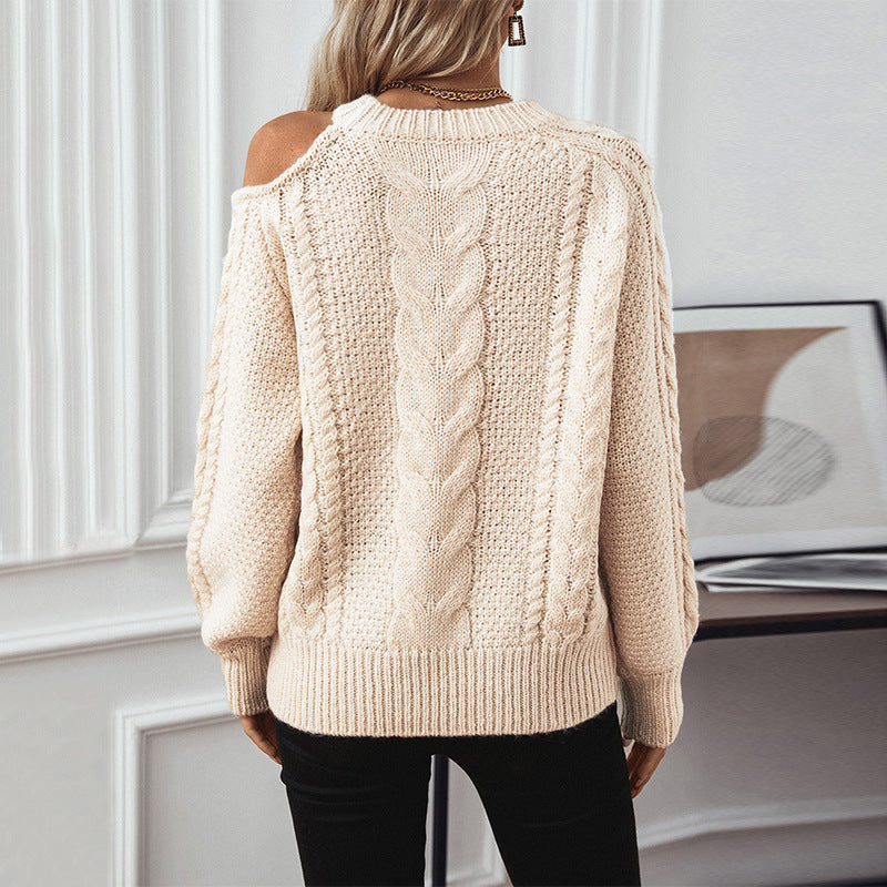 Women's chunky knit pullover with elegant structure and trendy puff sleeves
