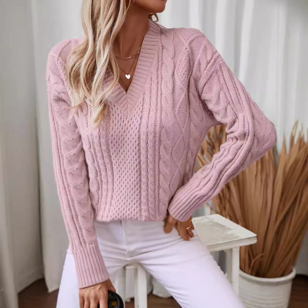 Women's fashionable knitted pullover with deep V-neck and cable pattern