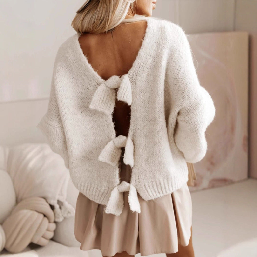 Women's casual knitted pullover with deep back cutout and bow details