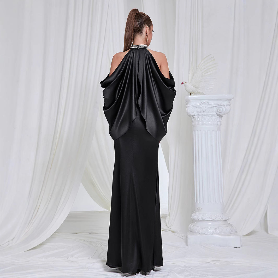 Ladies evening dress with shimmering cape design and elegant closure detail