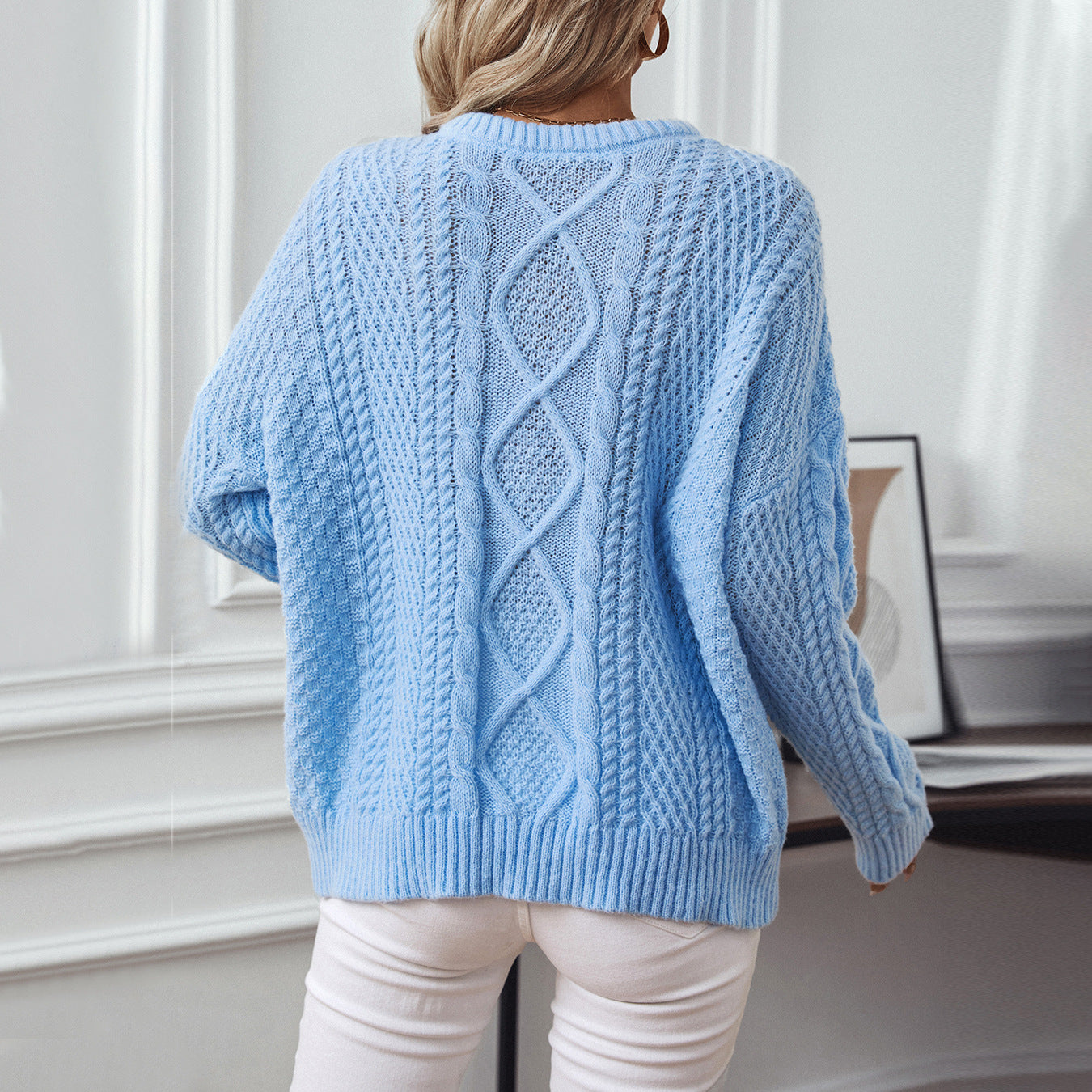 Women's knit pullover with textured cable design and round neck