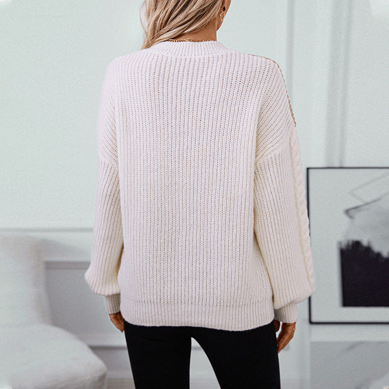 Ladies fashionable knit pullover with refined cable pattern sleeves and contrast colors