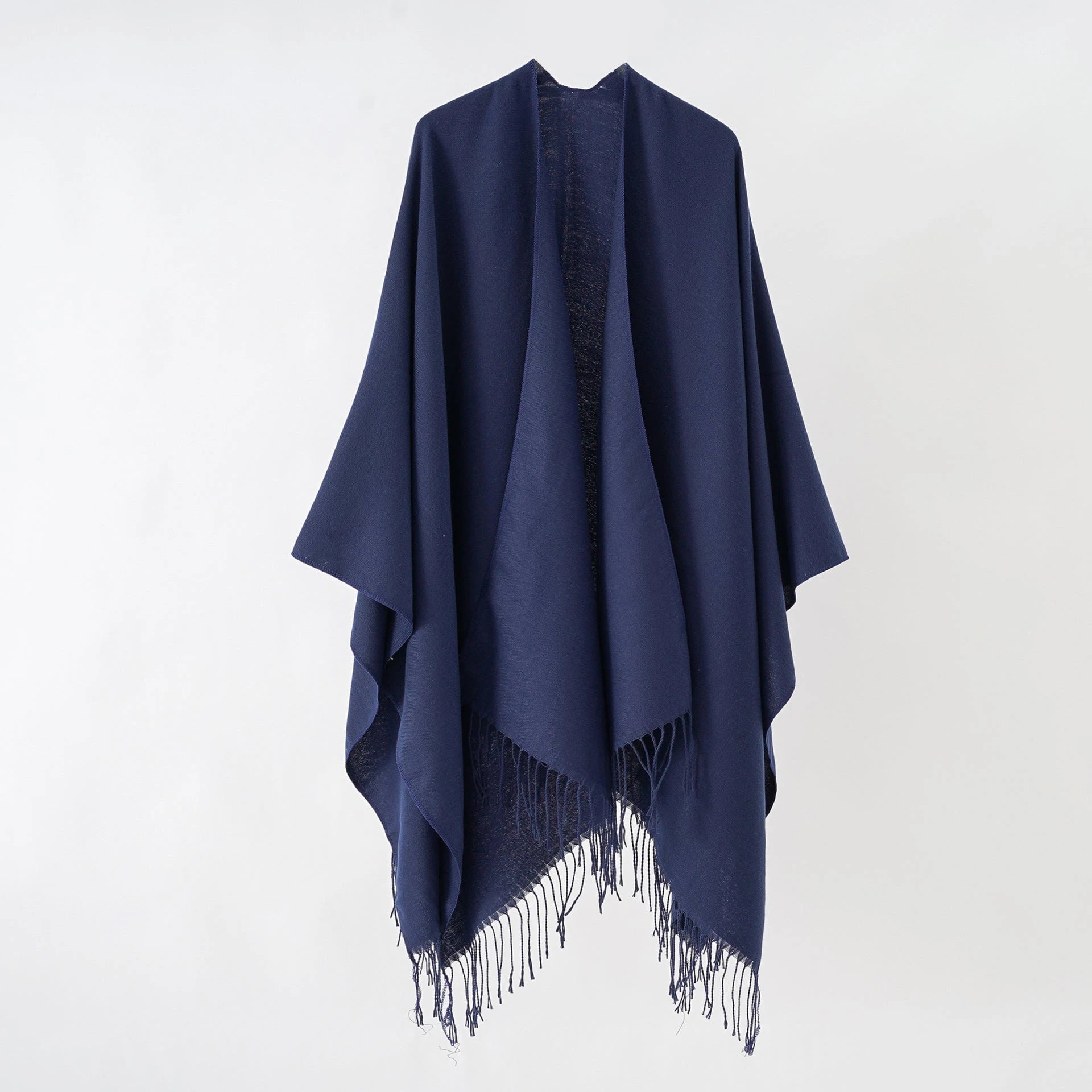 Women's stylish fringe poncho made from soft material with a luxurious drape