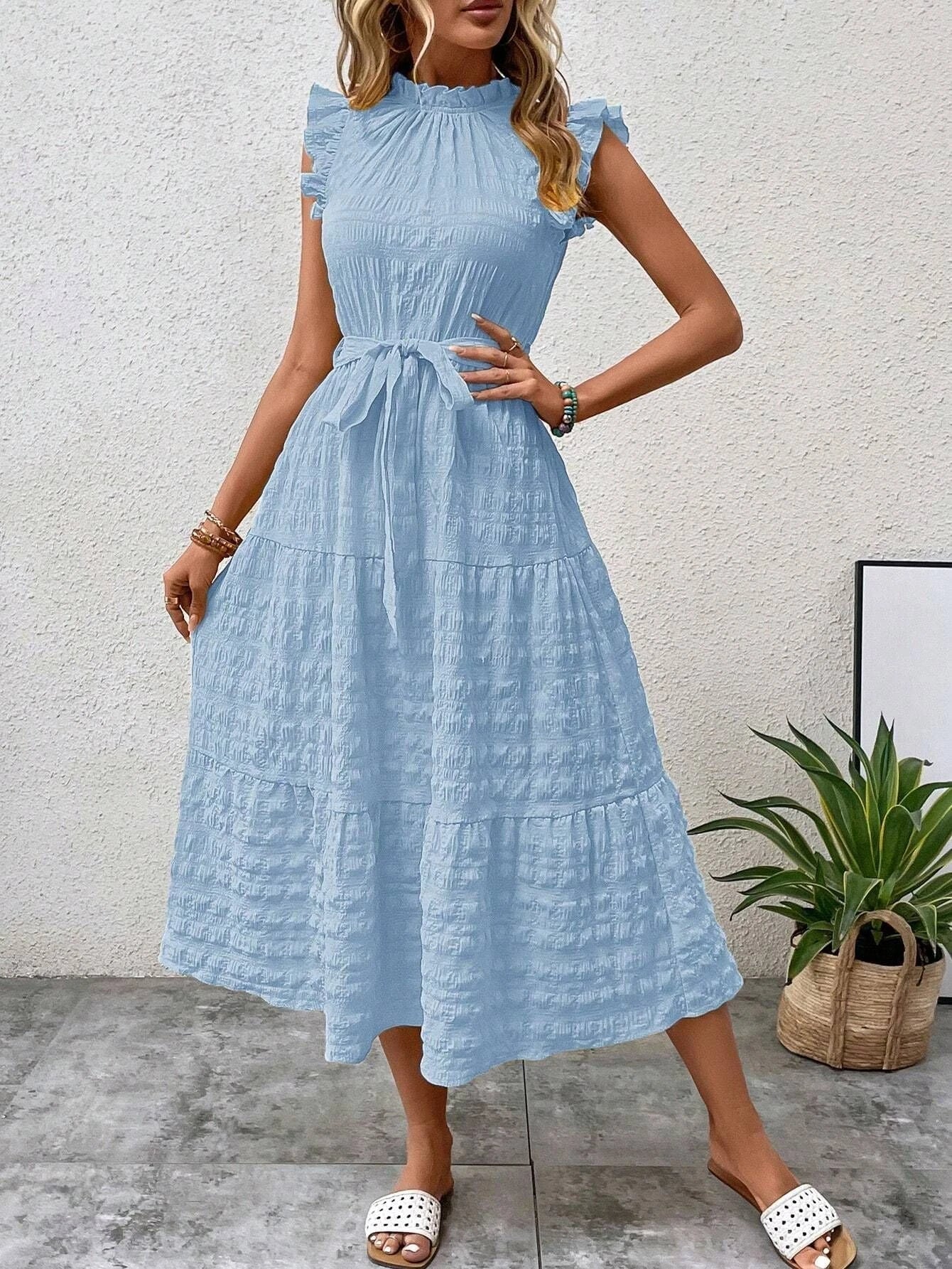 Women's wrap dress with ruffle details and flared dress hem