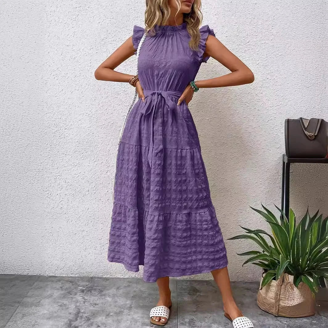 Women's wrap dress with ruffle details and flared dress hem
