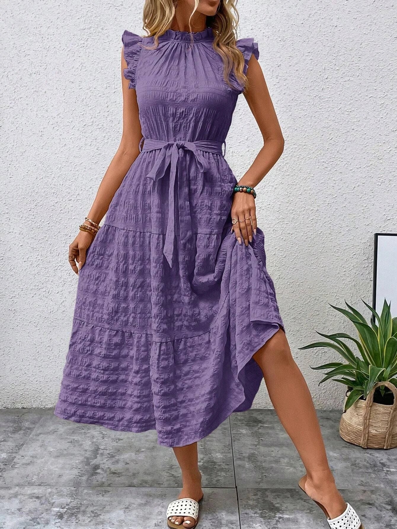 Women's wrap dress with ruffle details and flared dress hem