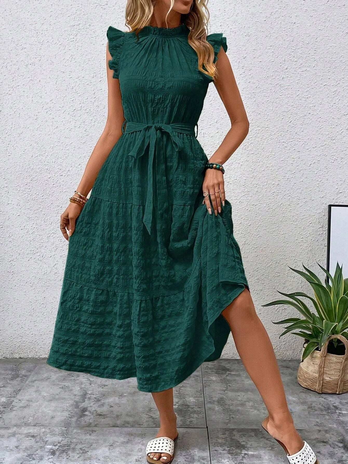 Women's wrap dress with ruffle details and flared dress hem