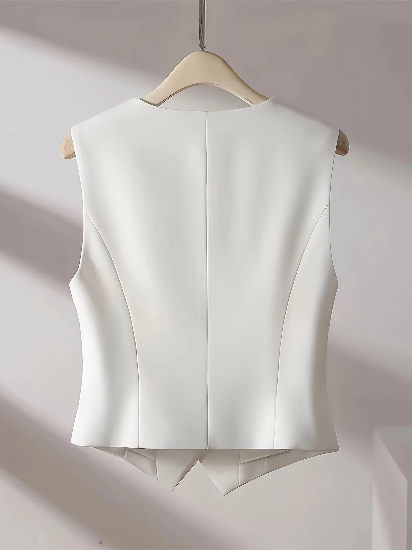 Solid Color Sleeveless Vest With V-neckline And Button Closure