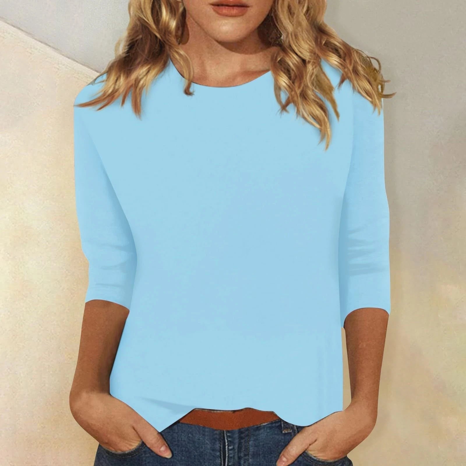 Women's casual top with elegant 3/4 sleeves and curved hem