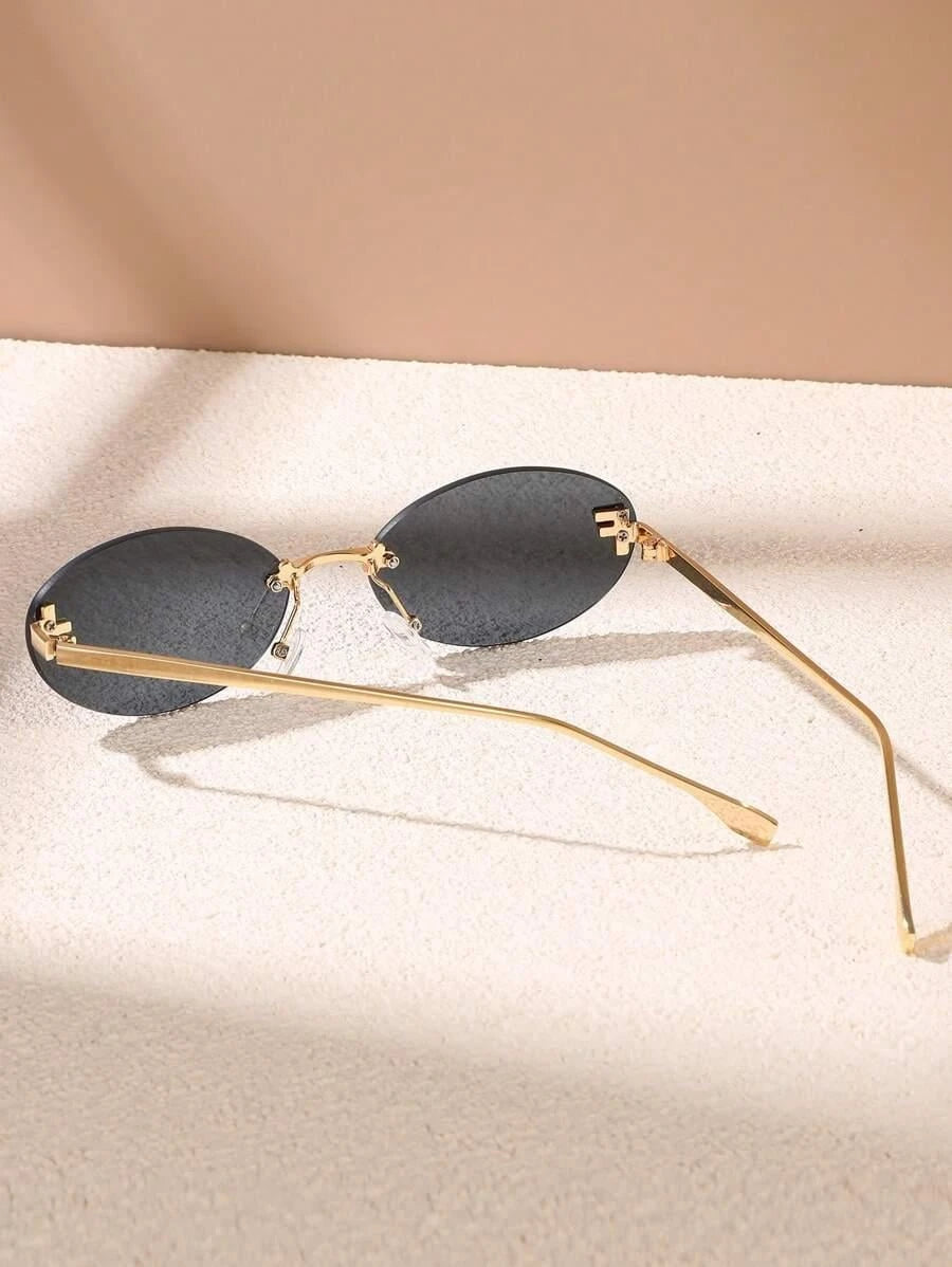 Oval Sunglasses With Golden Accents and Subtle Stones