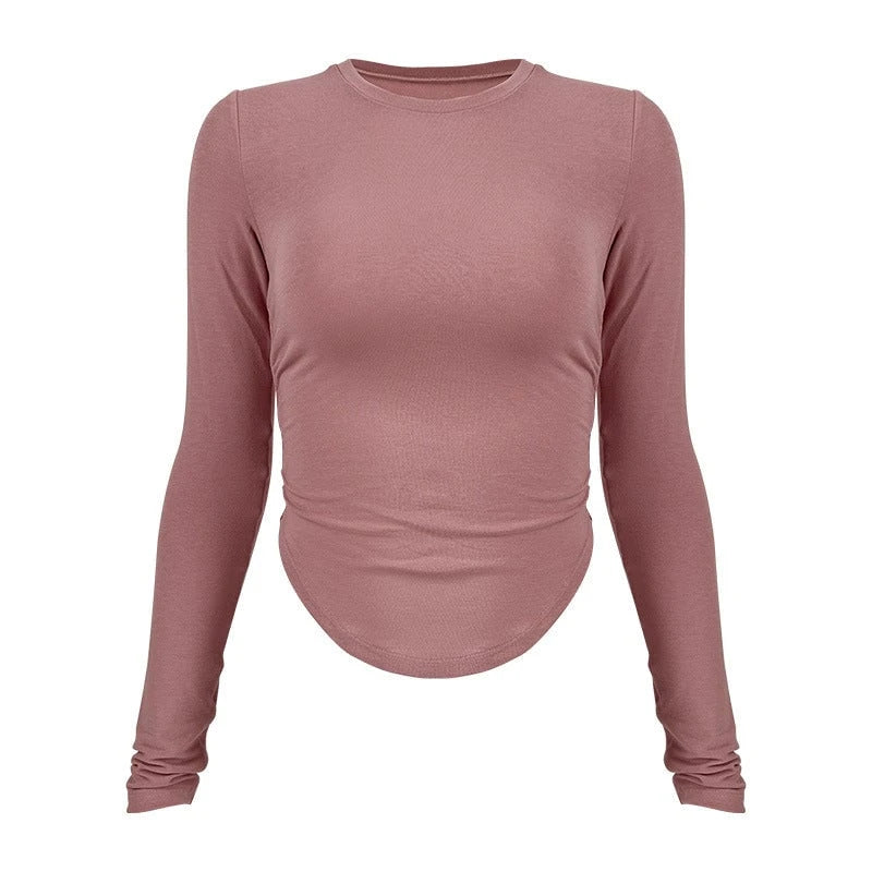 Ladies long-sleeved functional top with stylish gathering elements and figure-hugging cut