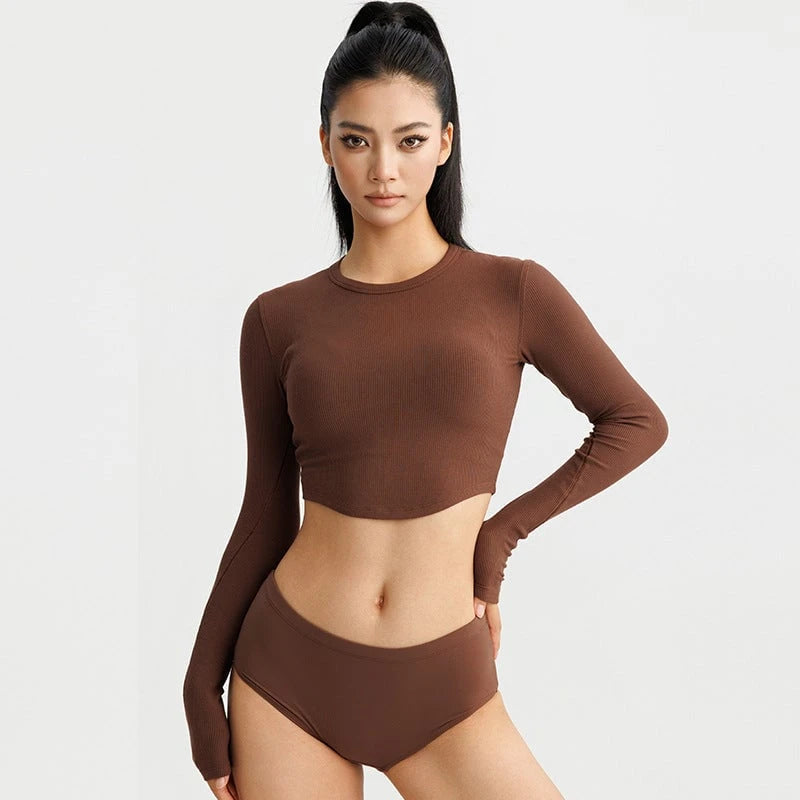 Women's stylish long sleeve crop top made of elastic ribbed material with round neckline