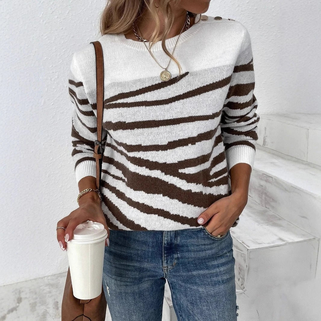 Ladies cozy knitted pullover with modern zebra stripe pattern and comfortable fit