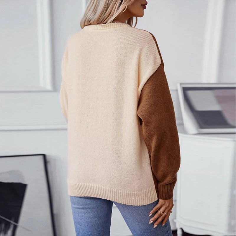 Ladies fashionable pullover with textured cable pattern and innovative color block design