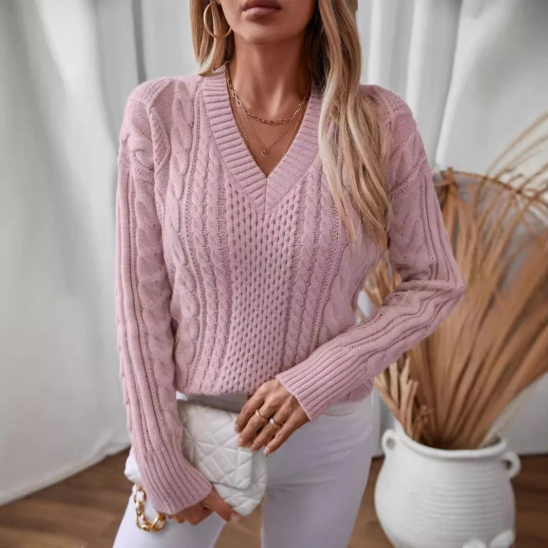 Women's fashionable knitted pullover with deep V-neck and cable pattern