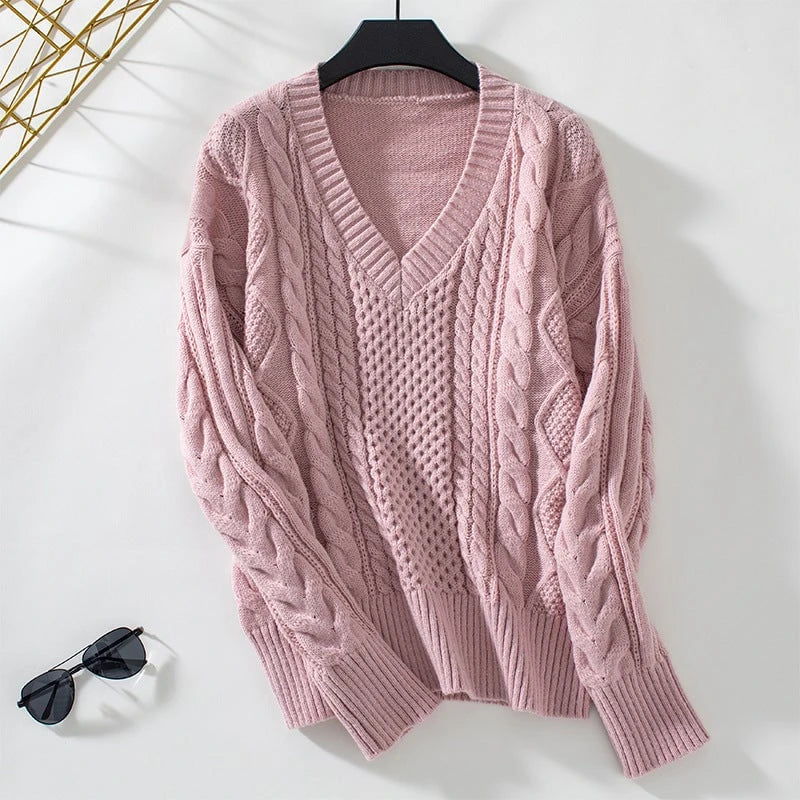 Women's fashionable knitted pullover with deep V-neck and cable pattern