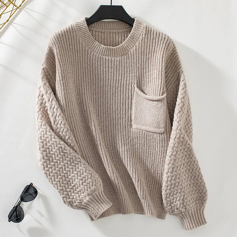 Women's pullover with textured cable pattern and chest pocket