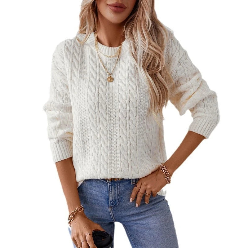 Women's knitted pullover with cable pattern and high cuffs