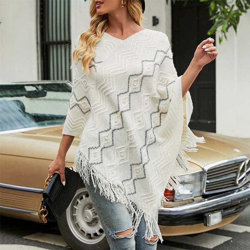 Ladies elegant poncho with eye-catching textured pattern and decorative fringes