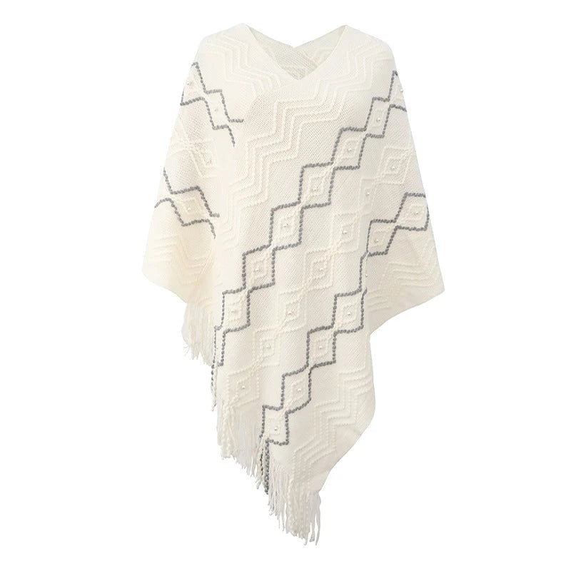 Ladies elegant poncho with eye-catching textured pattern and decorative fringes