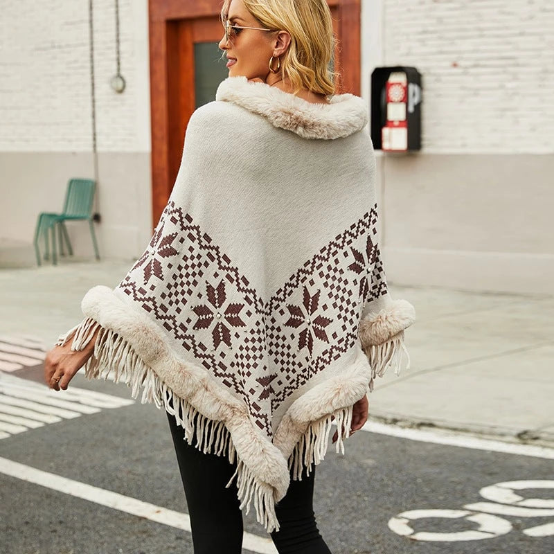 Ladies elegant poncho with decorative fringe design and faux fur trim