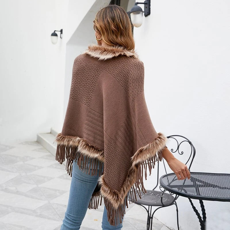 Women's elegant poncho with luxurious faux fur collar and decadent fringes