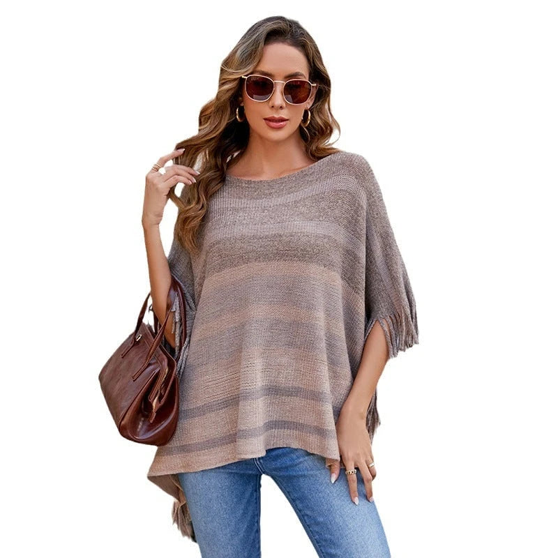 Ladies elegant poncho with textured design and fringed details