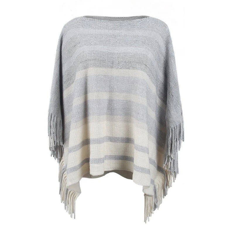 Ladies elegant poncho with textured design and fringed details