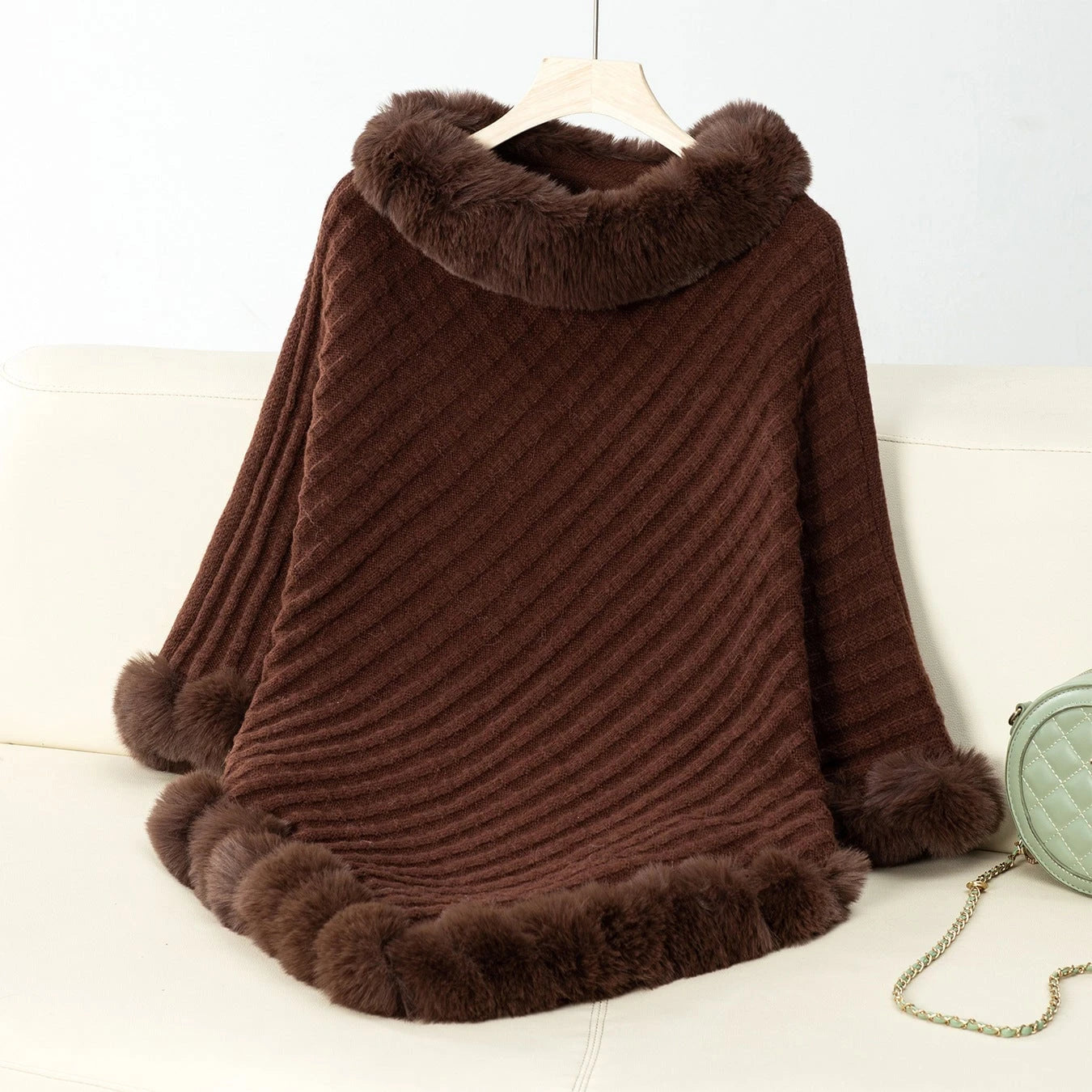 Women's cozy knitted blanket with luxurious faux fur trim