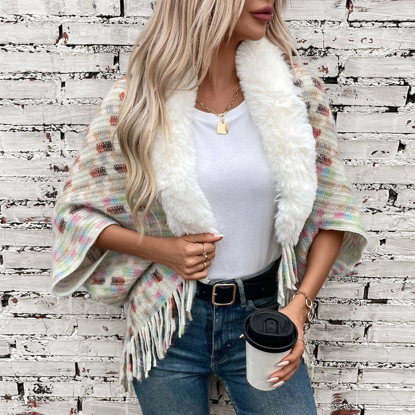 Ladies elegant poncho with luxurious faux fur collar and fringes