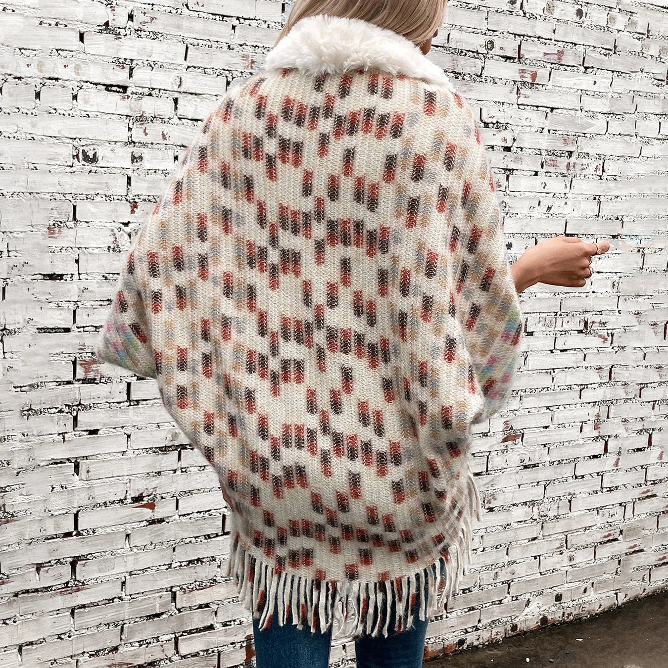 Ladies elegant poncho with luxurious faux fur collar and fringes