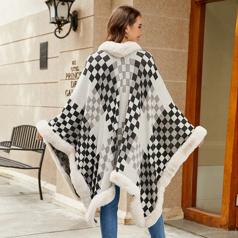 Ladies elegant knitted poncho with luxurious faux fur trim and geometric pattern