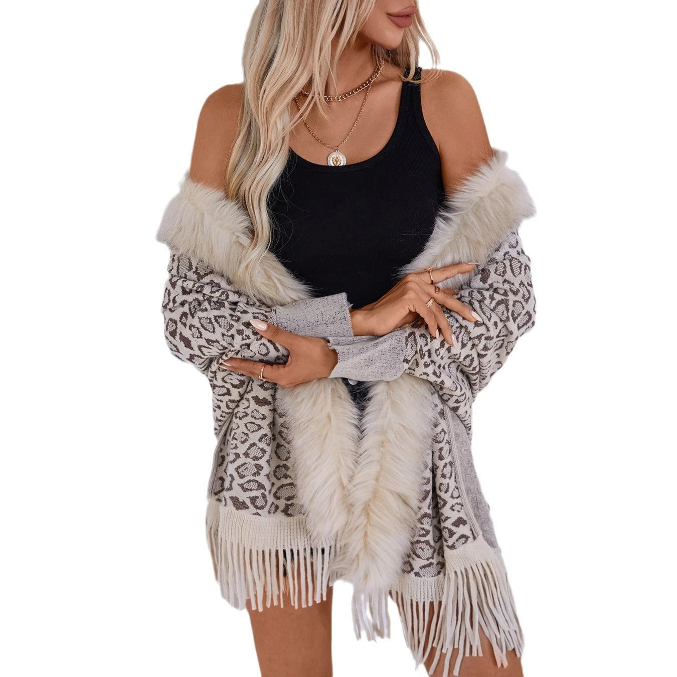 Ladies elegant knitted poncho with luxurious faux fur collar and fringed hem