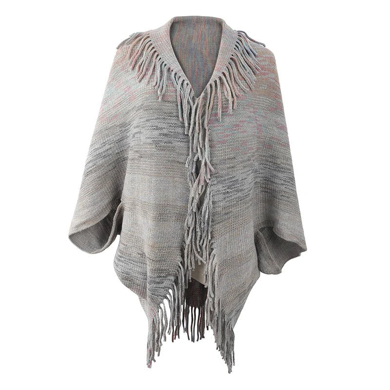Ladies fashionable poncho with fringed hem and textured design